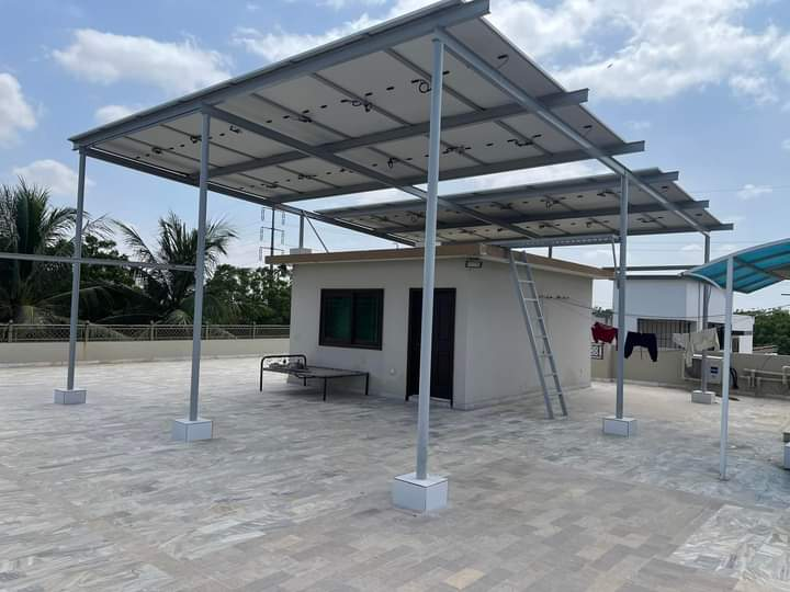 Raised rooftop solar installation with a steel mounting structure